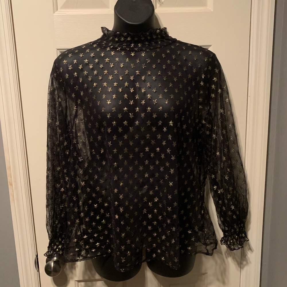 Sheer black top with gold stars